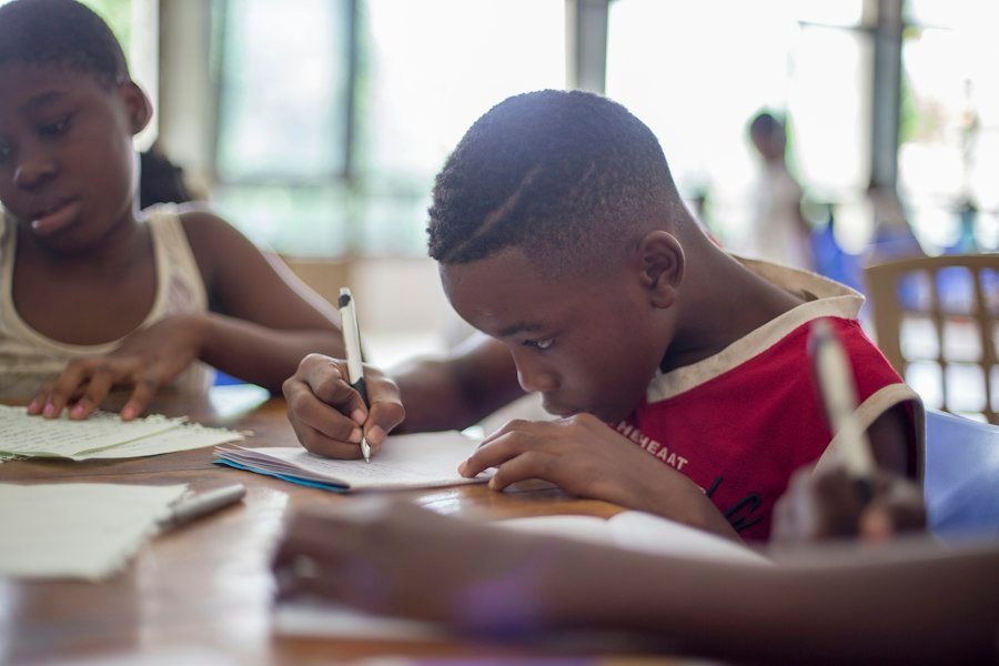 A pupil writing during a lesson