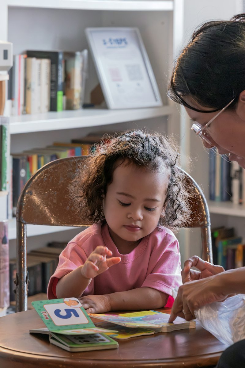 A young pupil concentrating on a reading activity