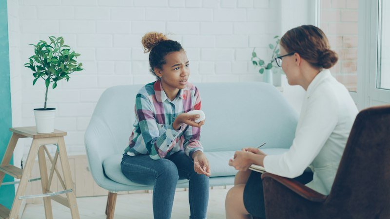 A mentor talking with a young person